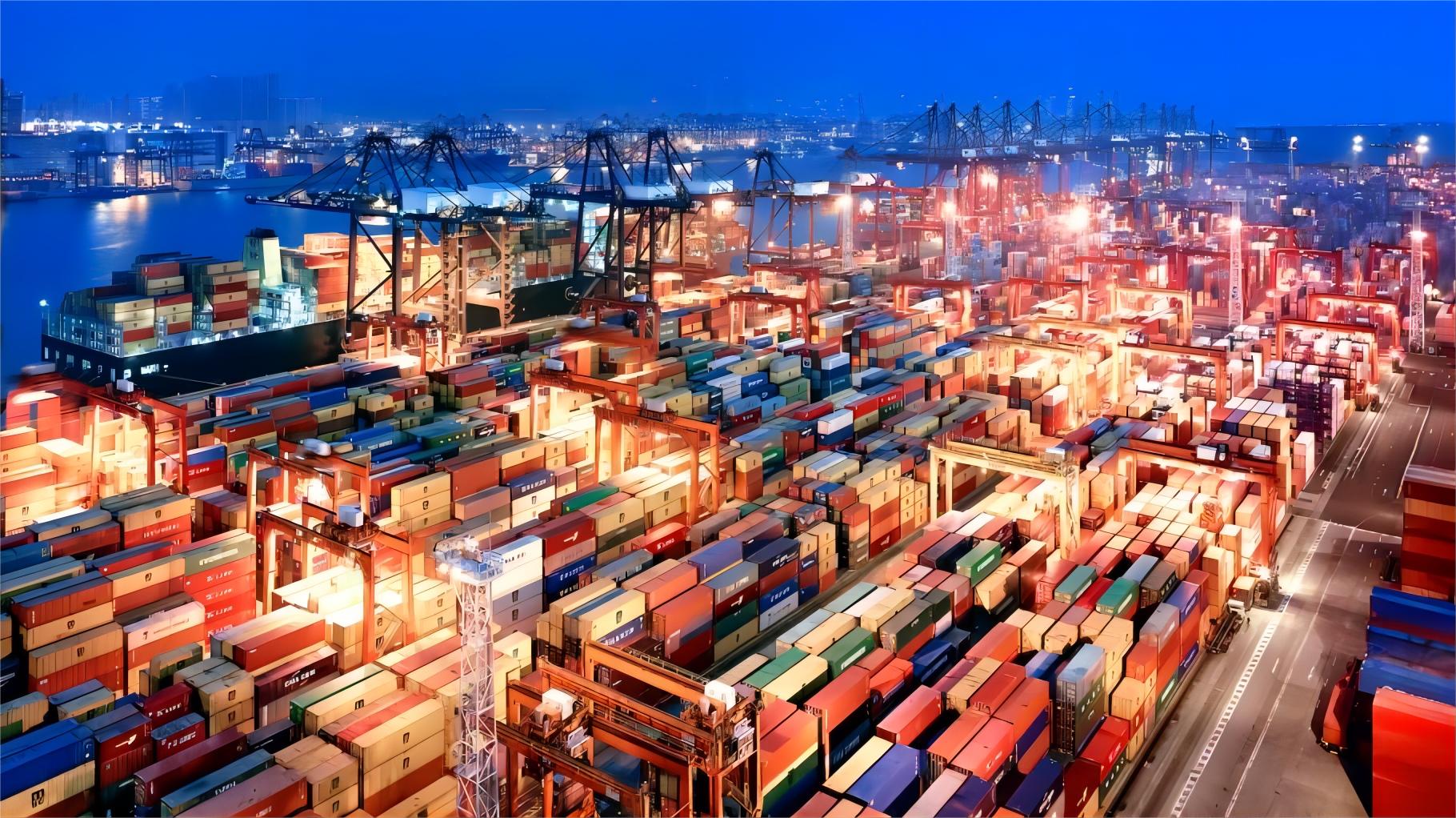 Modern cargo ship arriving at a busy international port